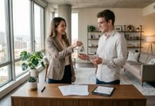 Original tenant giving apartment keys to new subtenant with lease documents