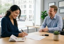 New immigrant signing first car insurance policy at US agency desk